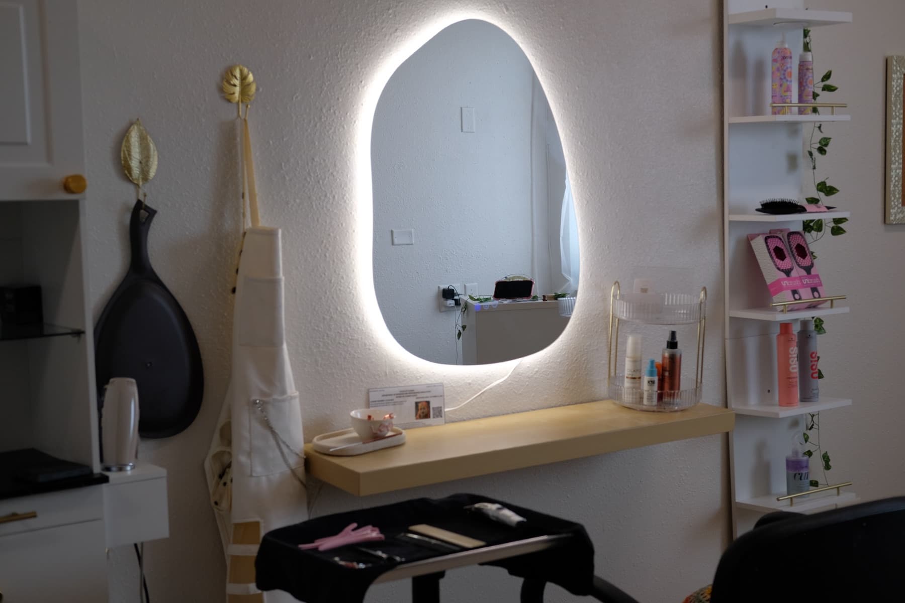 Illuminated styling station inside Cosmos Studio Titusville